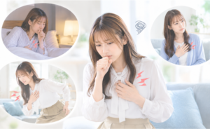 咳をして胸を抑える女性